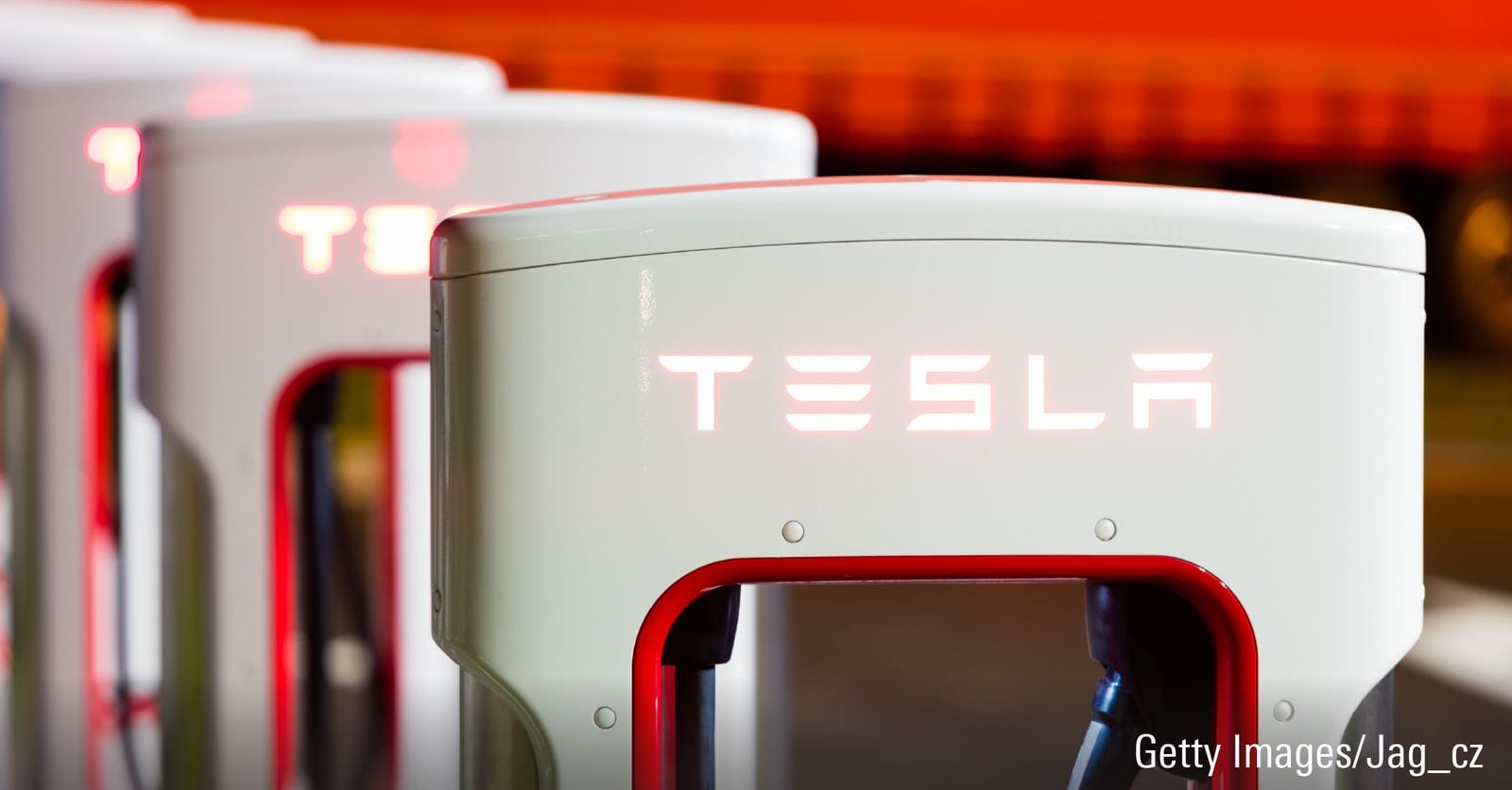 Tesla stock story ahead of company earnings. Image of a Tesla Supercharger.